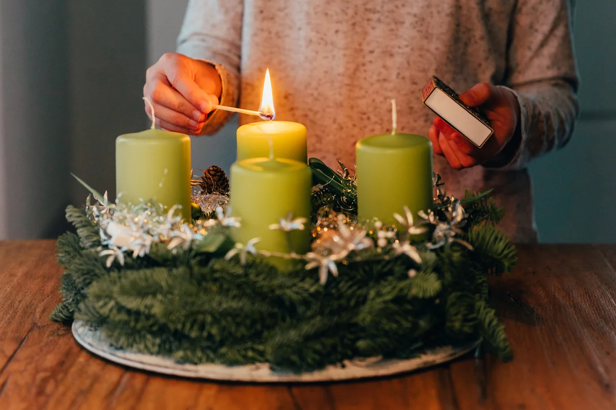 Lighting the first candle on swiss advent wreath