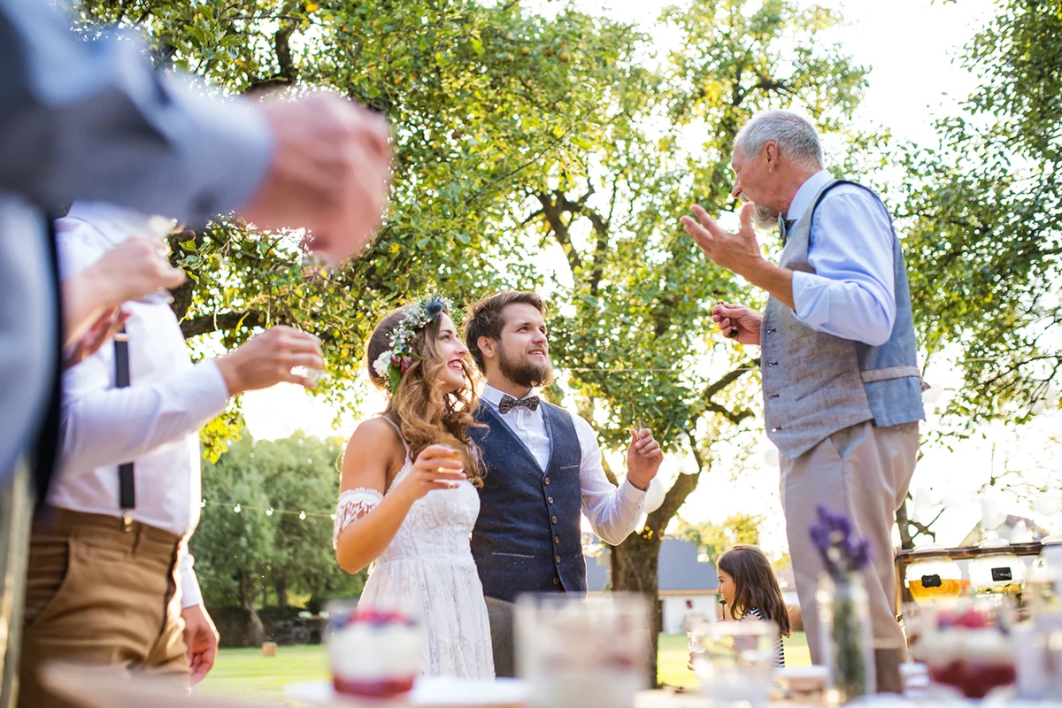 A Senior Man Making Speech At Wedding Reception