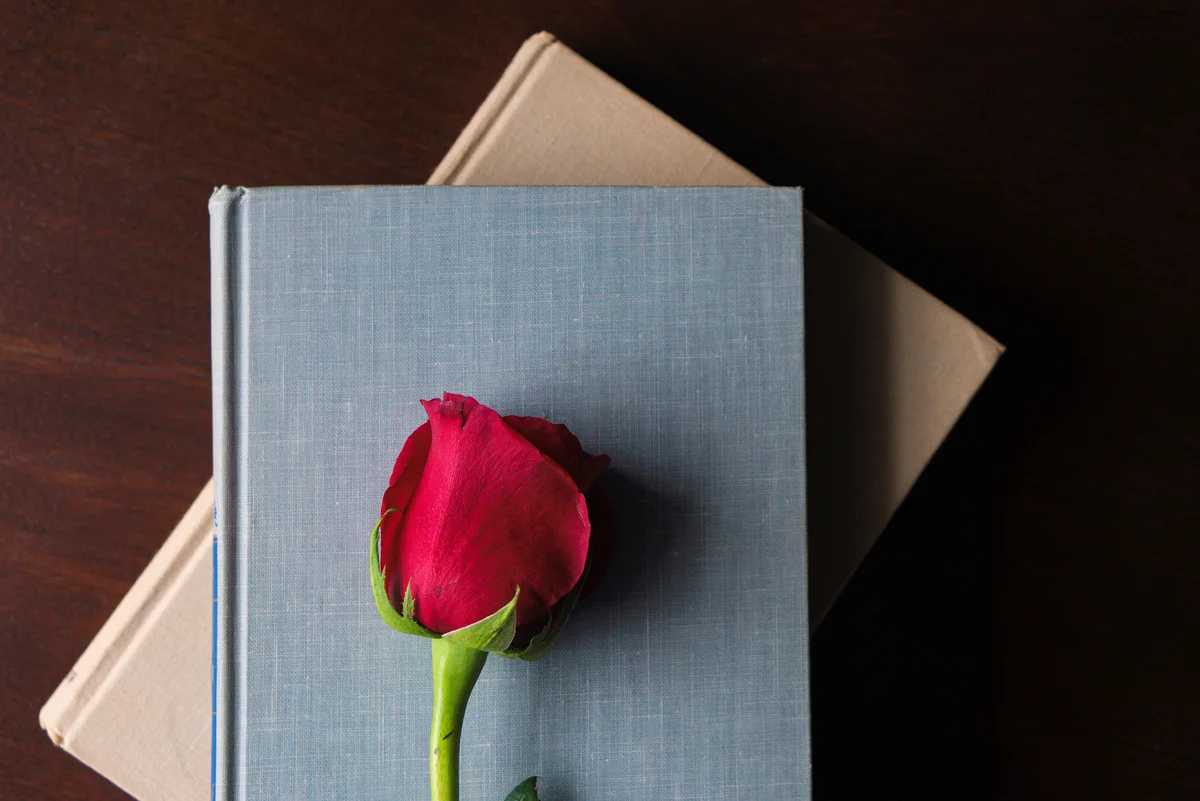 two books and a rose