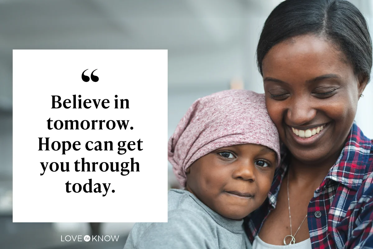 Supportive mother holds child with cancer