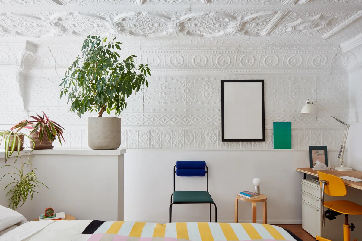 Bedroom loft with white, tin metal ceiling