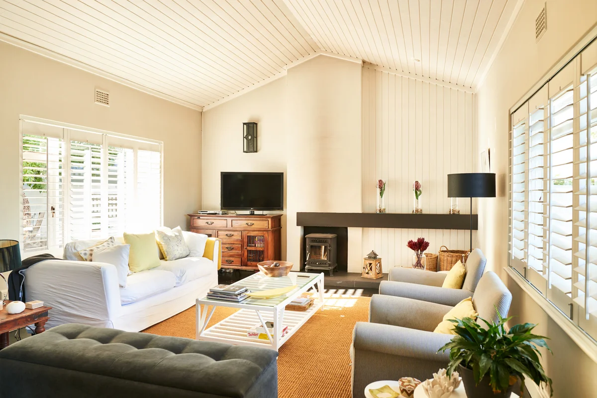 Interior of the living room of a modern home with comfortable furniture with vaulted ceilings