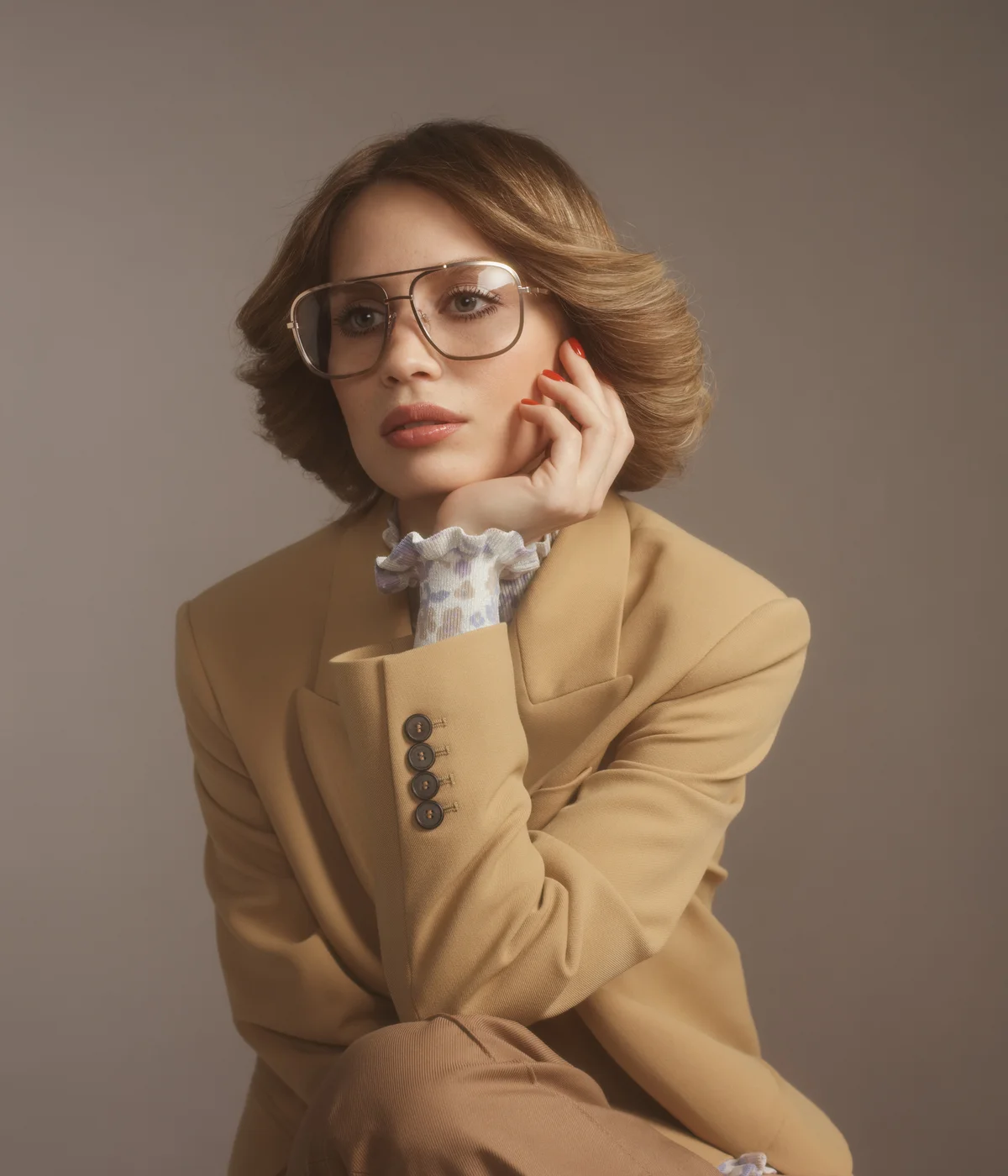 Fashionable woman in beige suit, 70s style