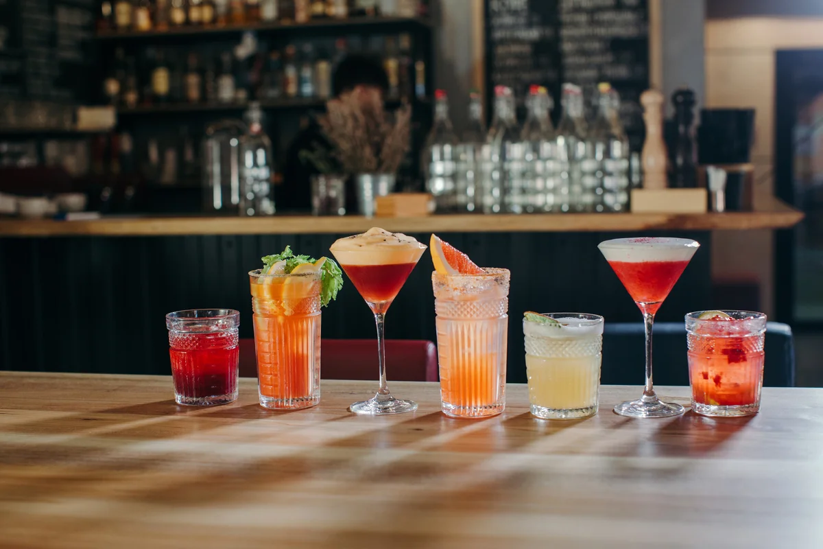 drinks lined up on a bar