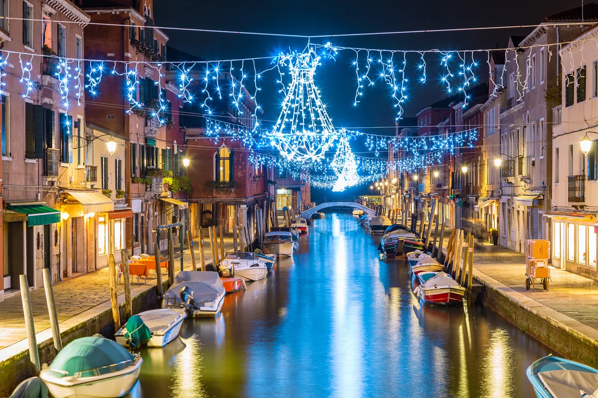 Canal at dusk with Christmas lights hanging