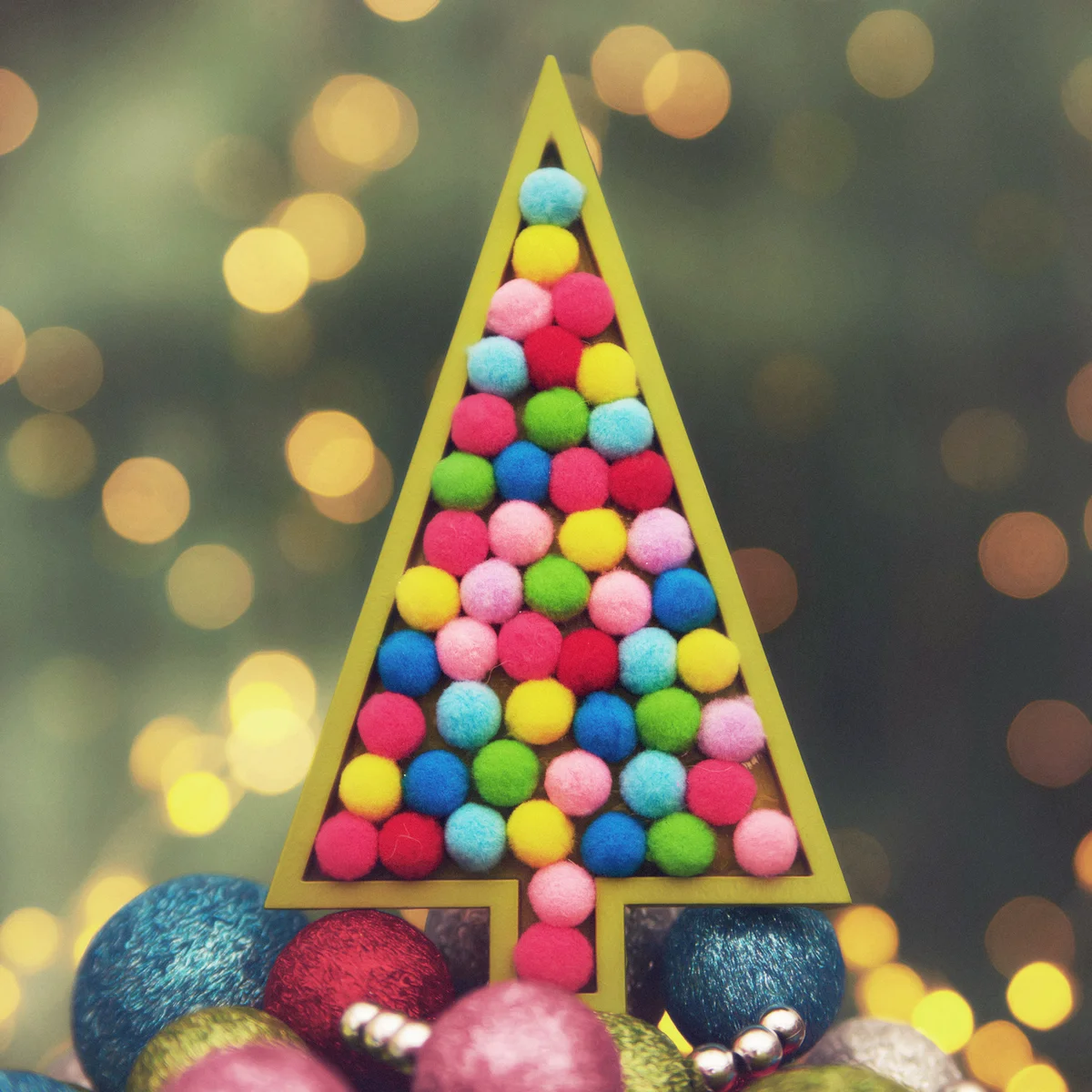 Brightly Colored Rainbow Christmas Tree with Ornaments and Christmas Lights