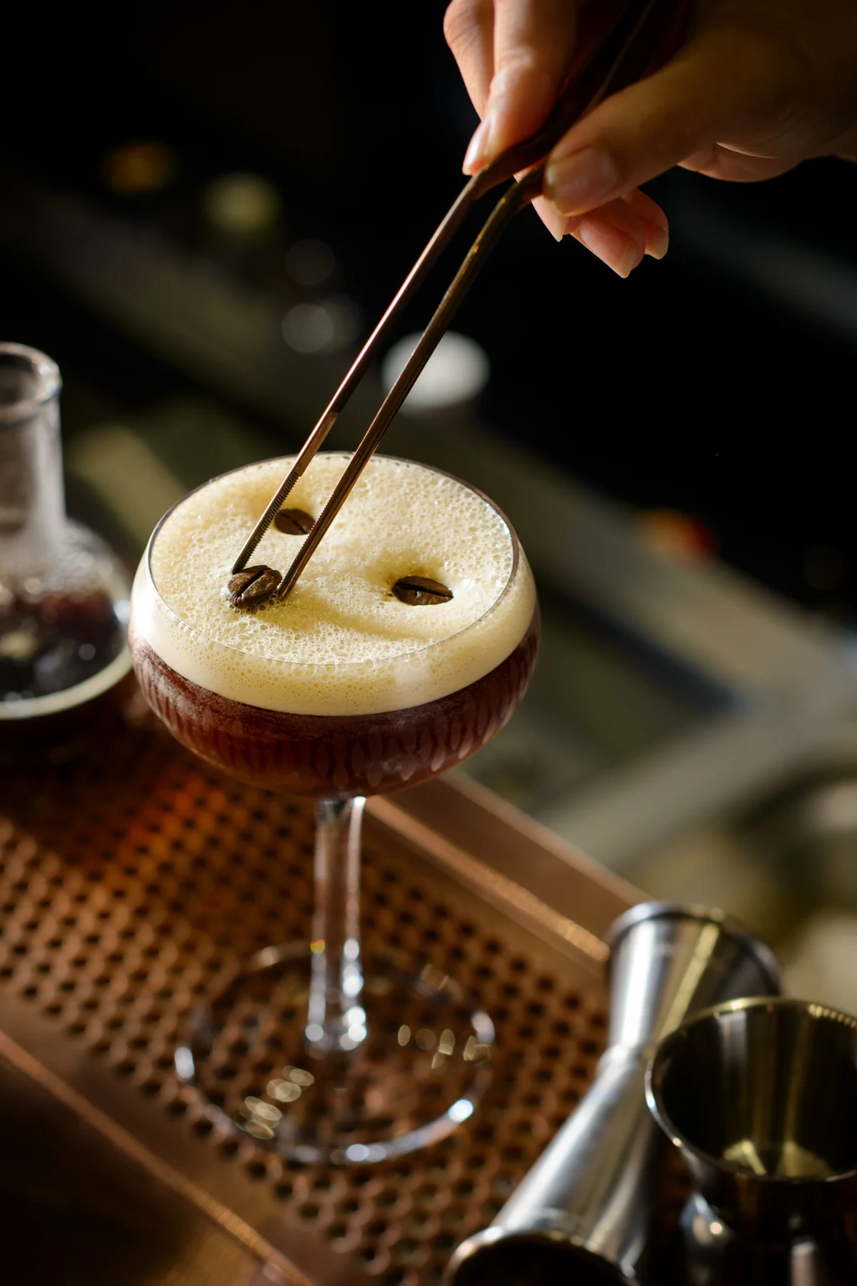 Glass of espresso martini with coffee beans