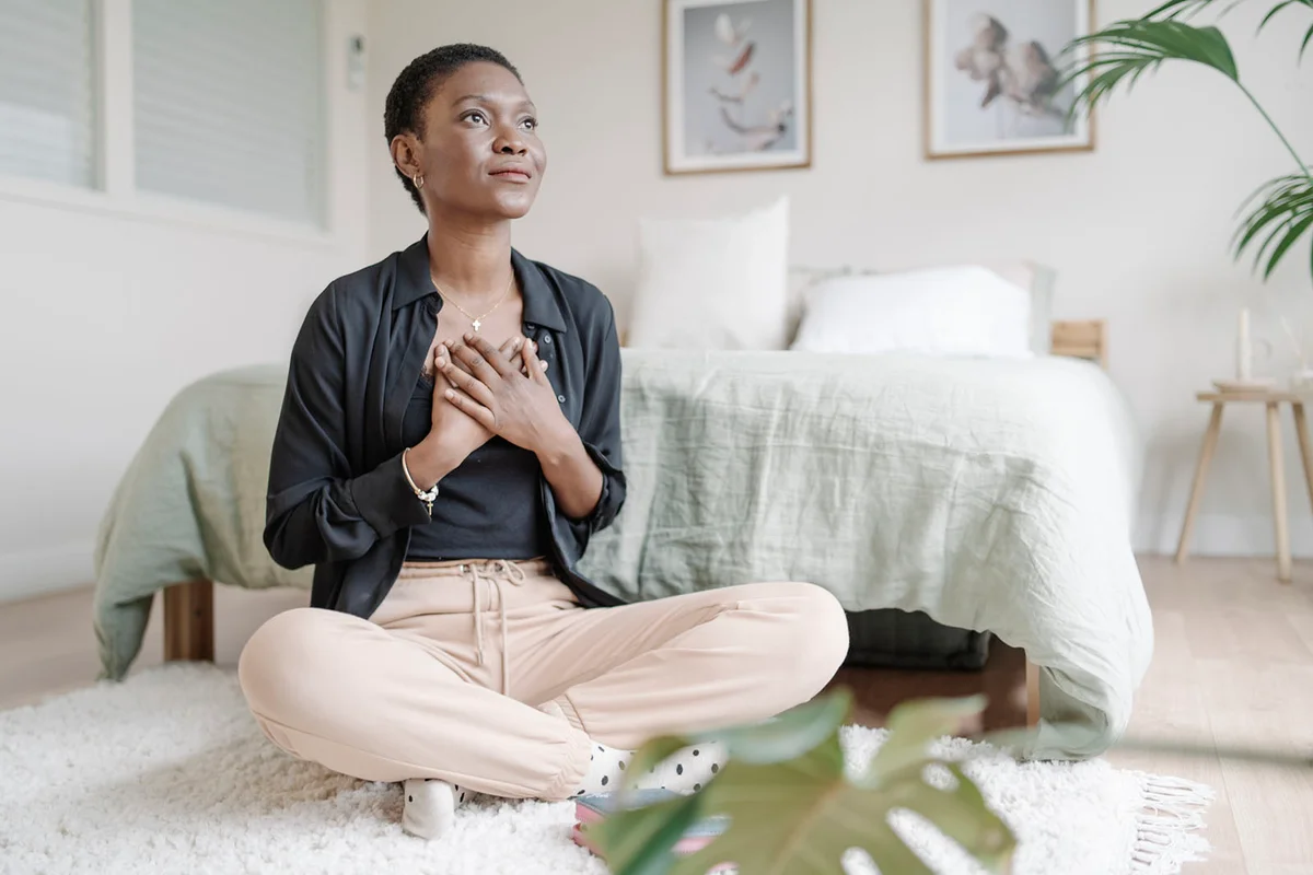 woman with hand on chest showing gratitude