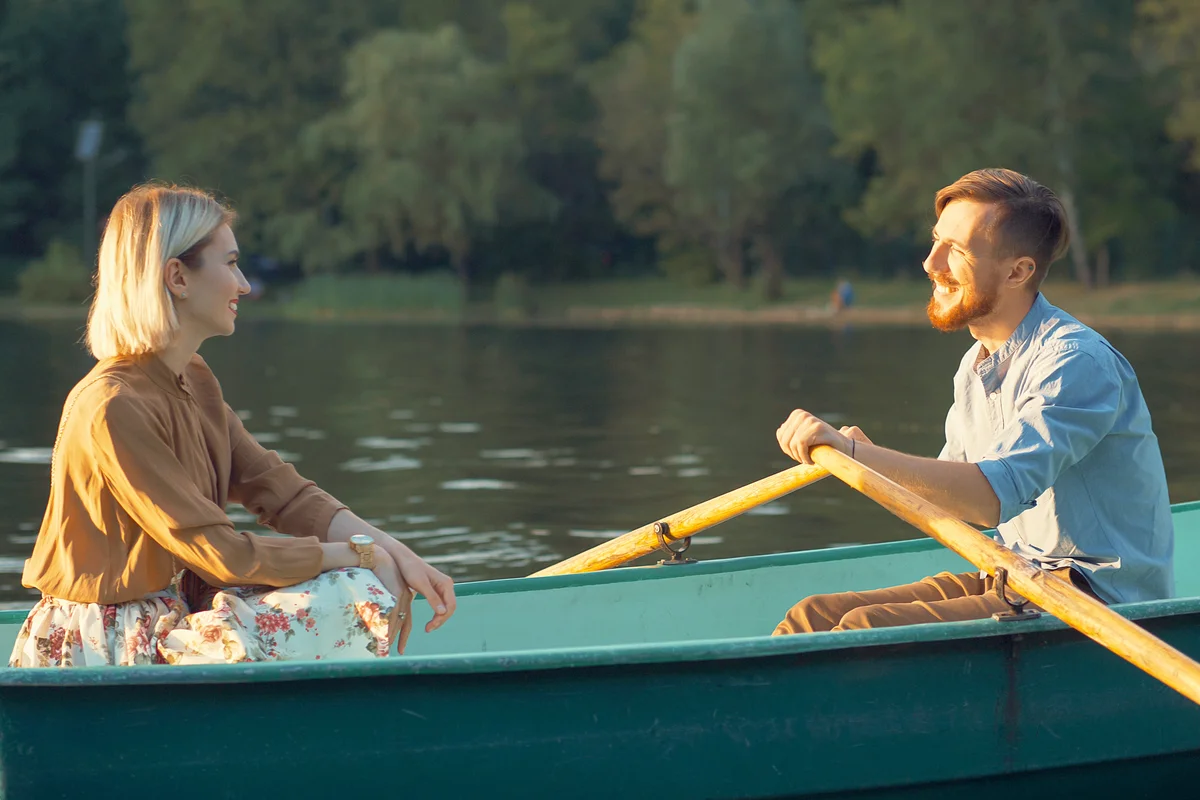 Smiling young couple in a boat