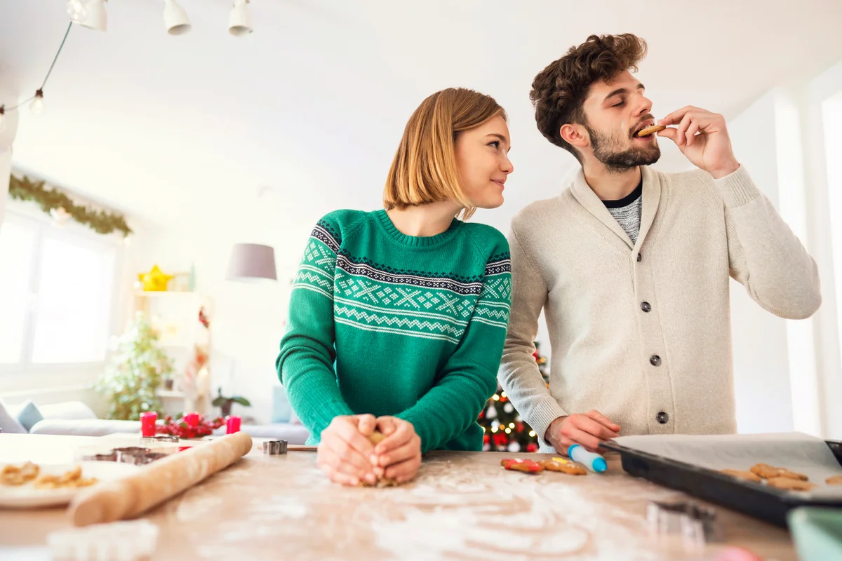 Couple baking Christmas cookies