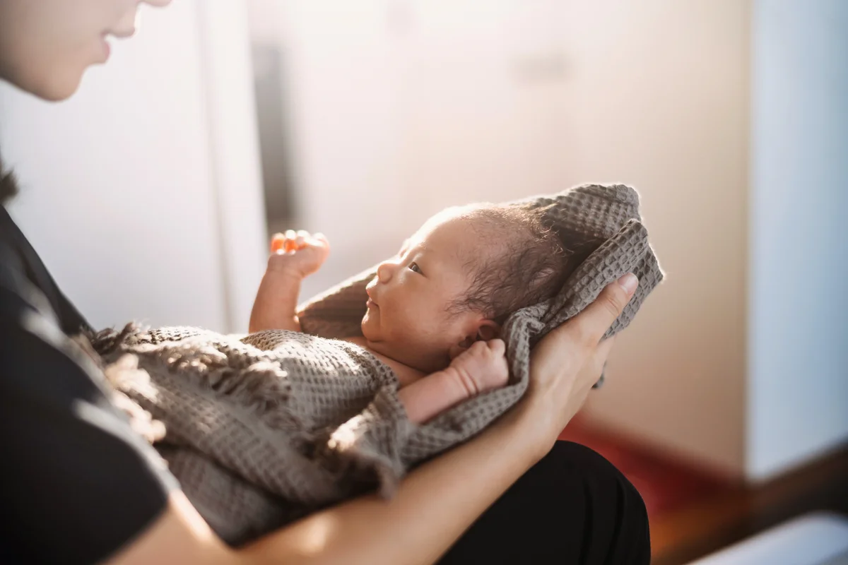 Mother holding newborn baby