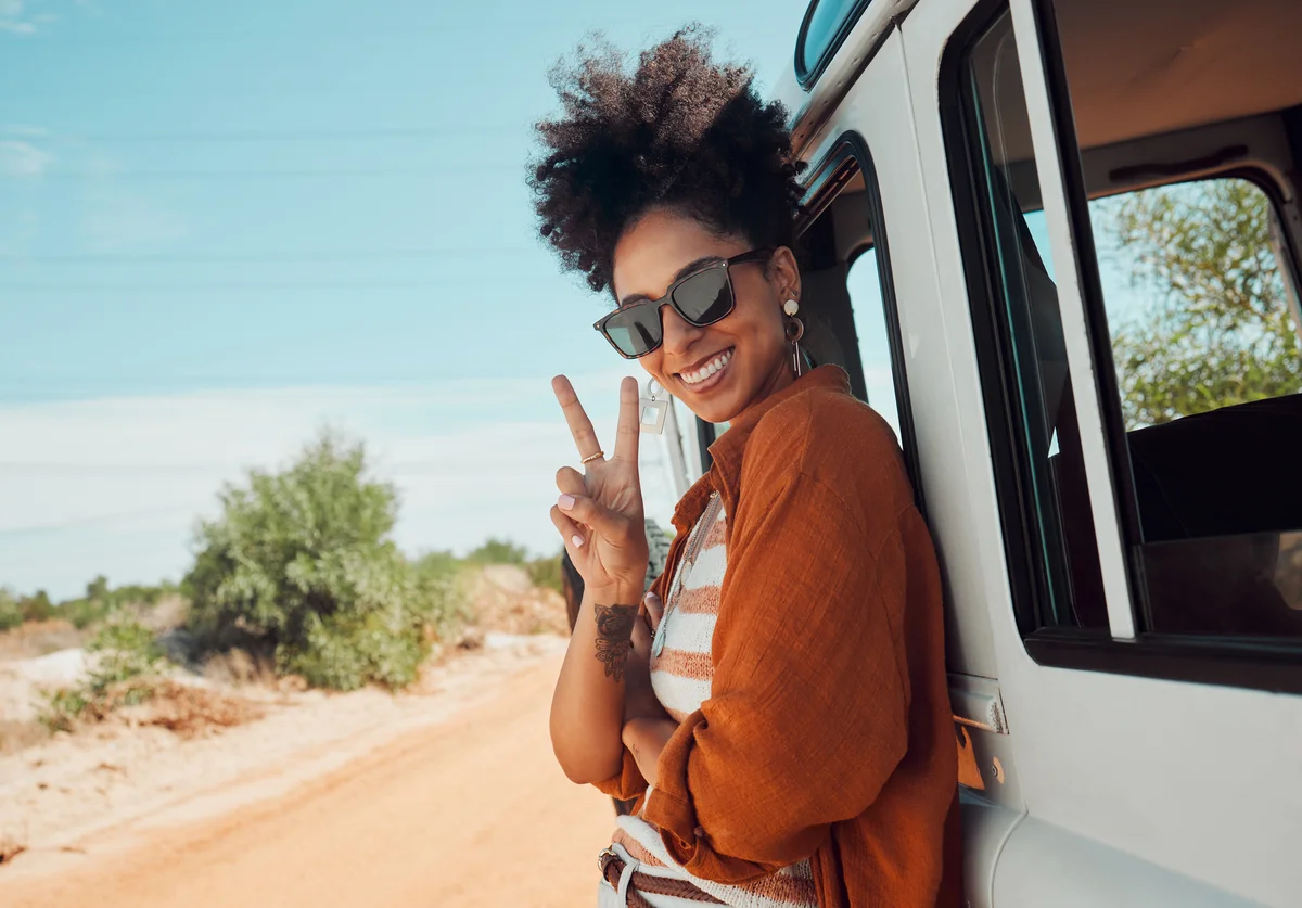 woman by a travel van