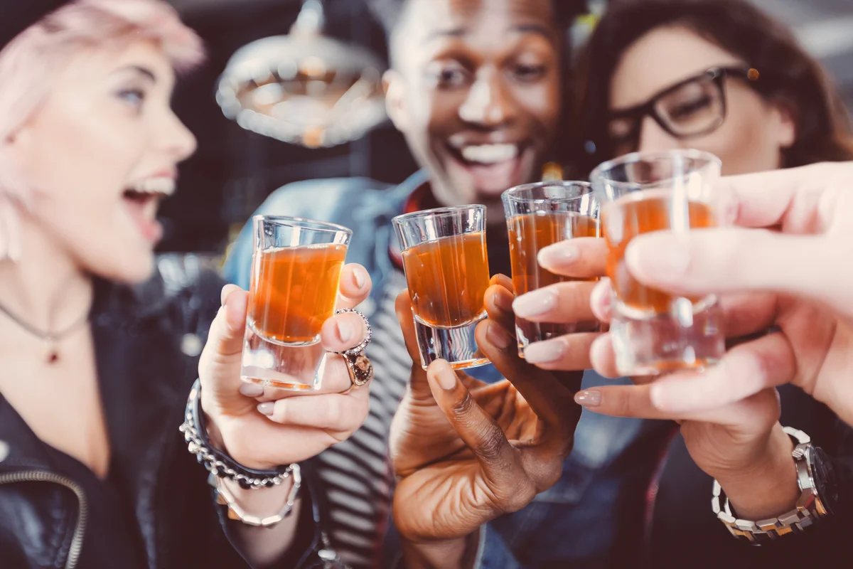 Friends enjoying party shots