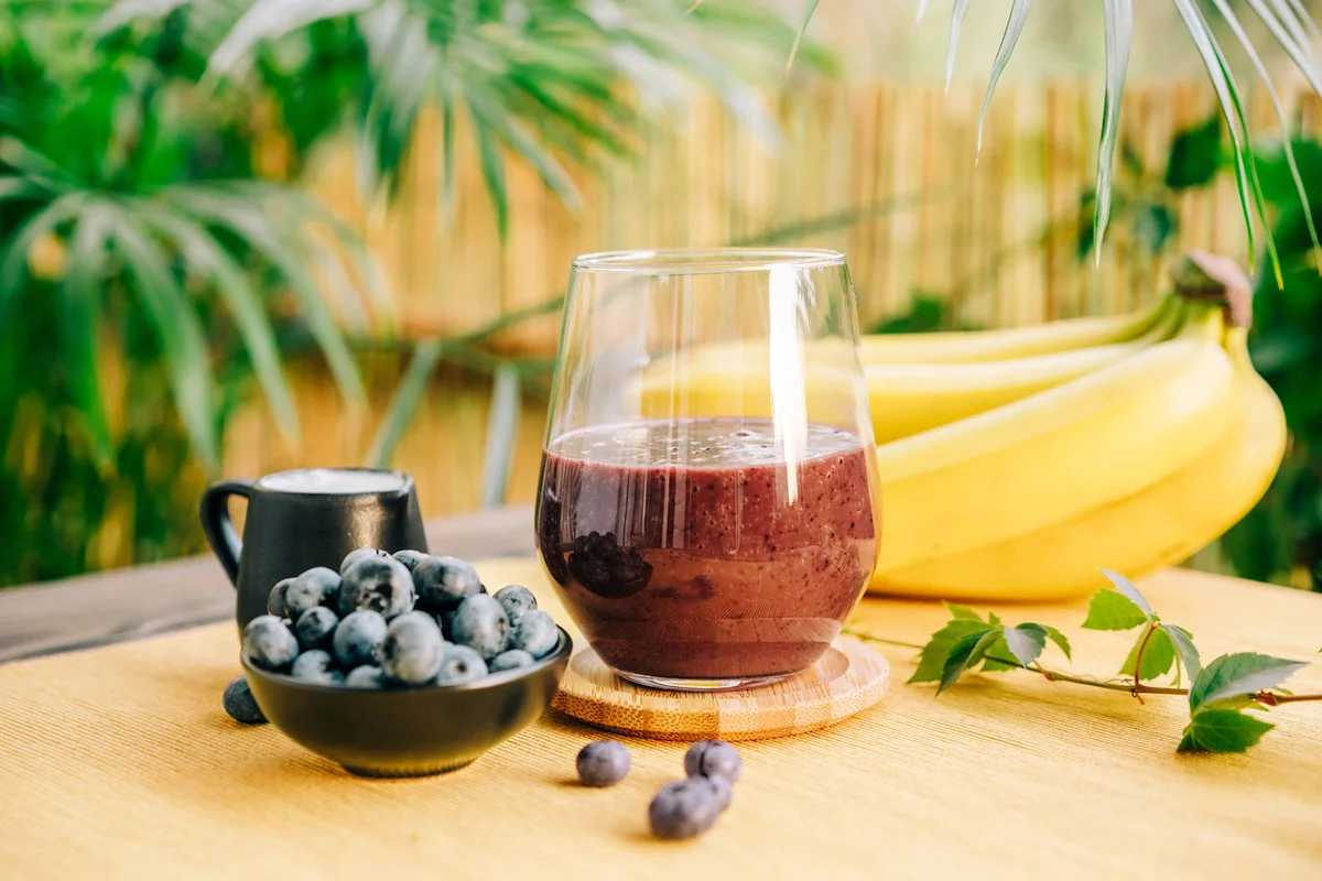 Fresh blueberry, banana smoothie in glass