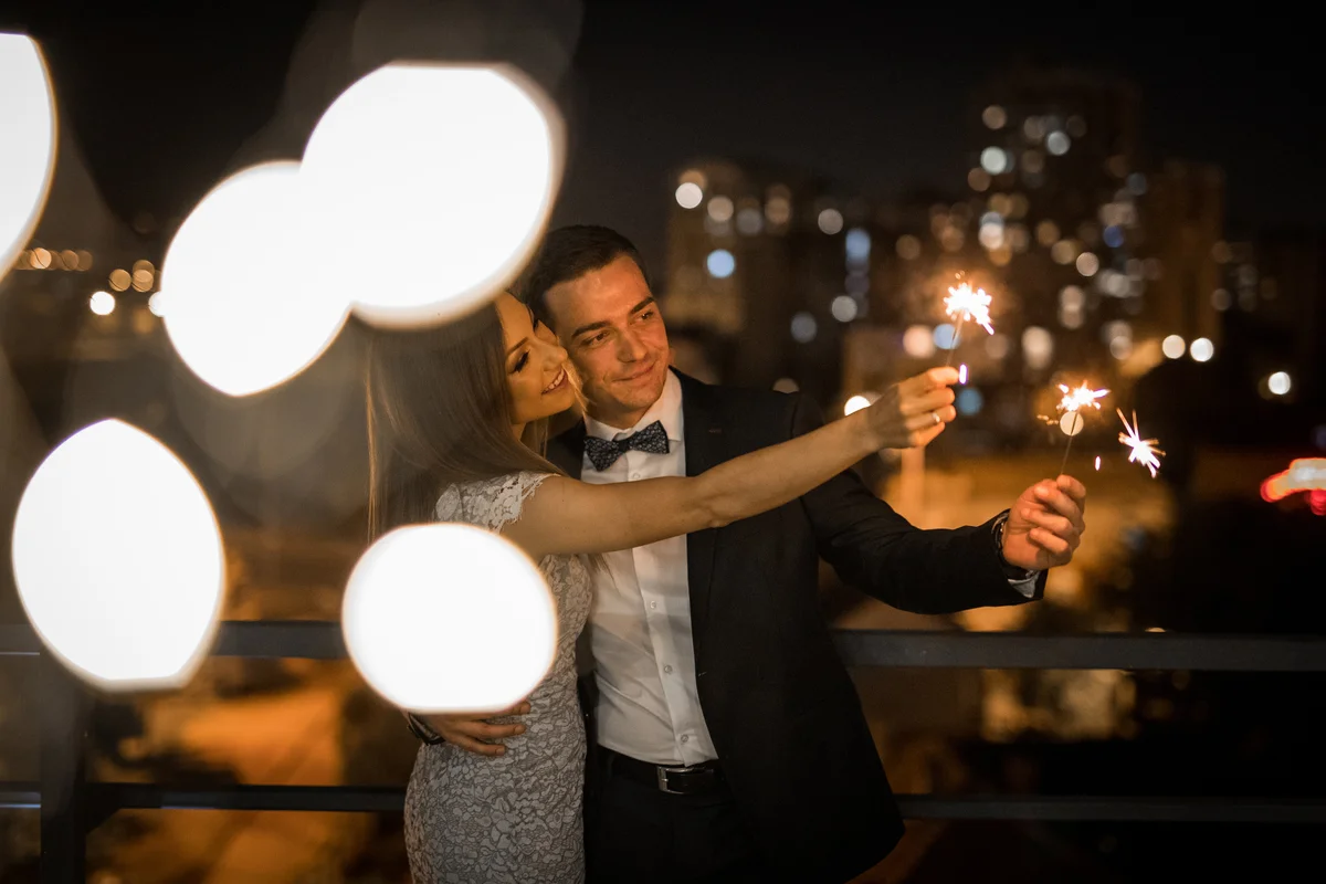 couple at party with sparklers