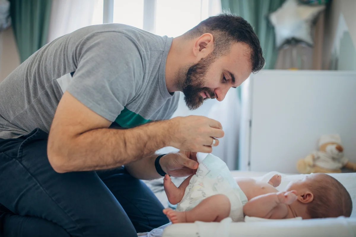 Father Changing Baby Son Diaper