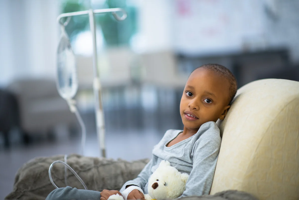 child in hospital with stuffed animal
