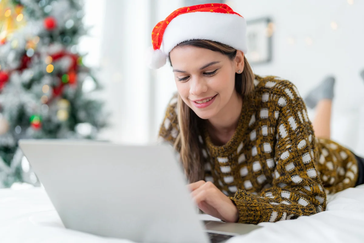 Woman online with santa hat