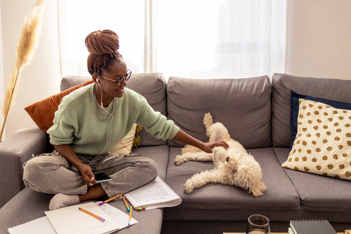 Woman playing with dog