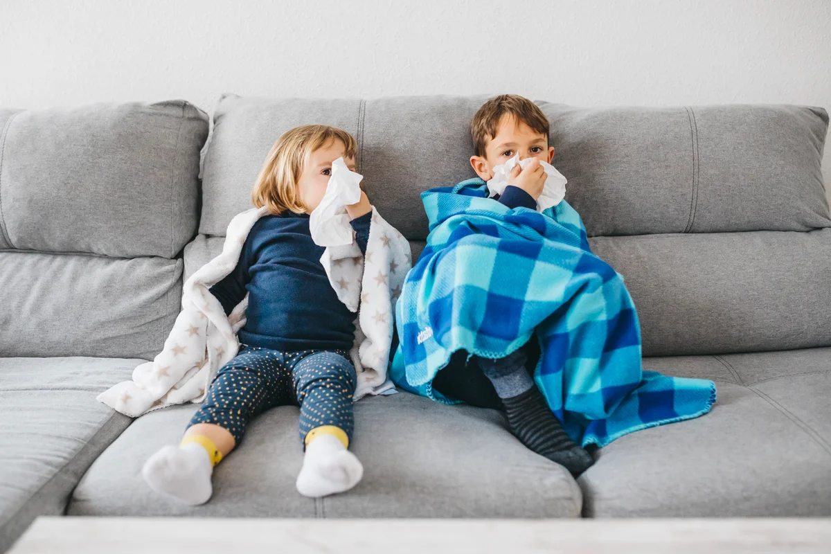 Sick toddlers on couch