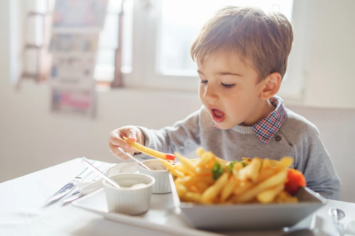 toddler eating french fries