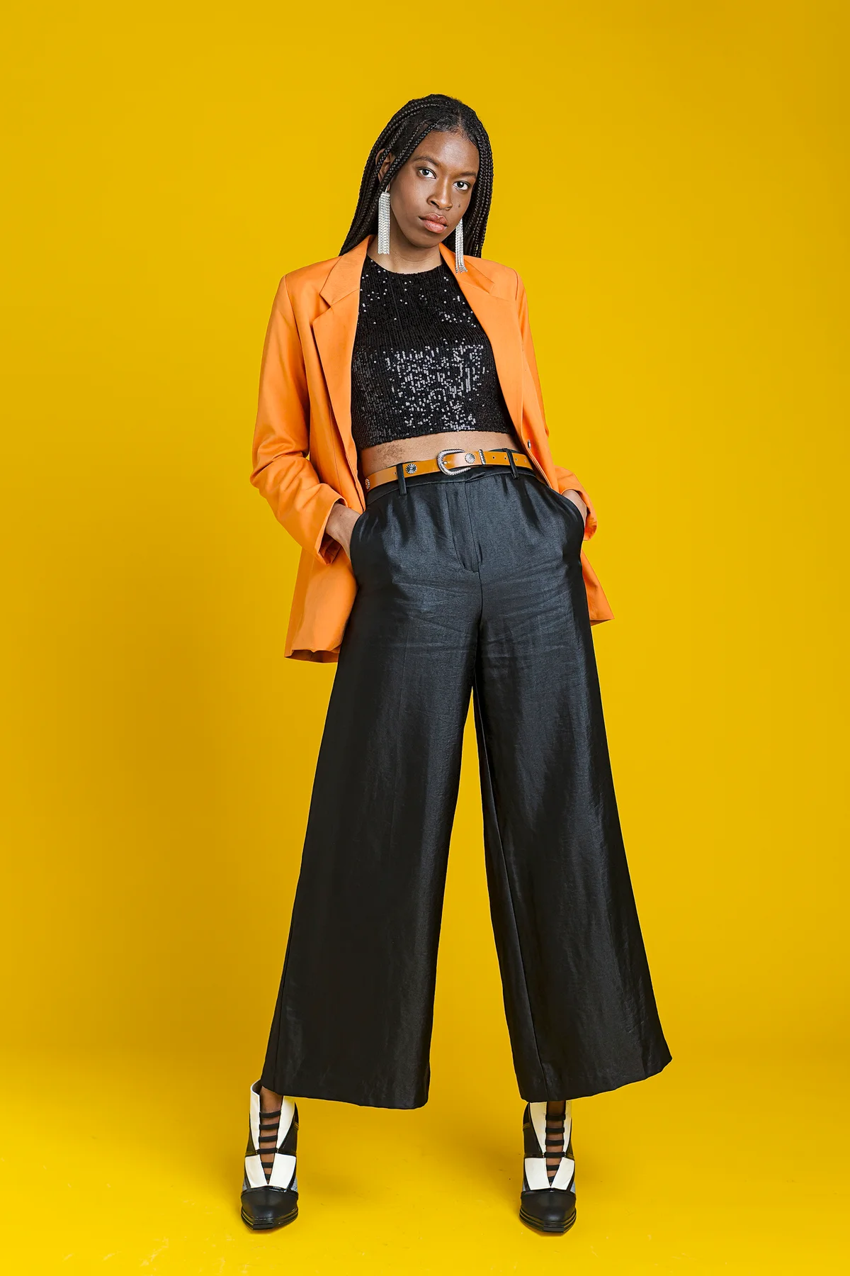 Fashionable woman wearing glittering top with black pants
