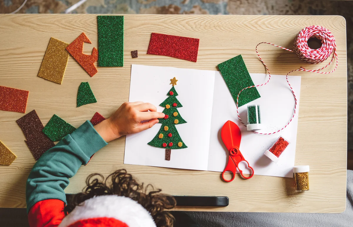 kid doing card craft