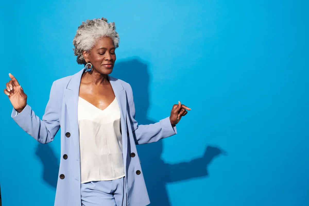 confident woman on a blue background