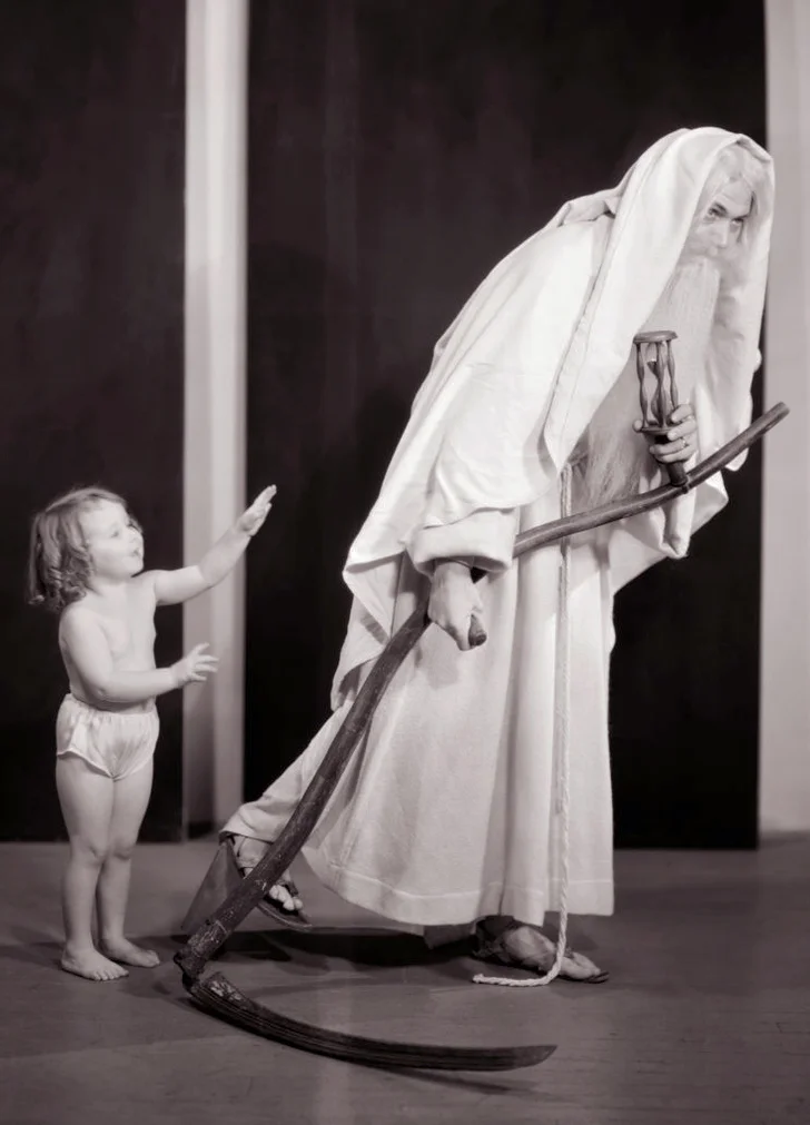 1930s new year toddler baby girl bidding goodbye to father time