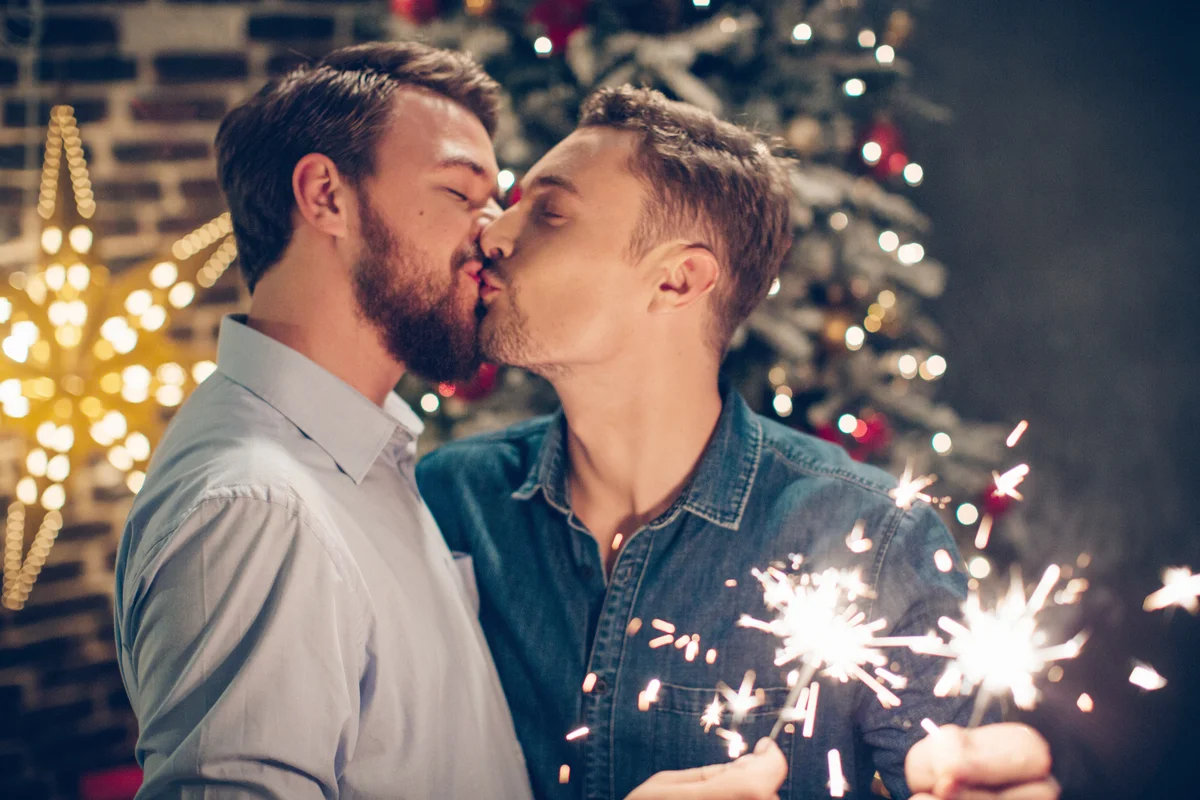 Couple celebrating New Year's with a kiss