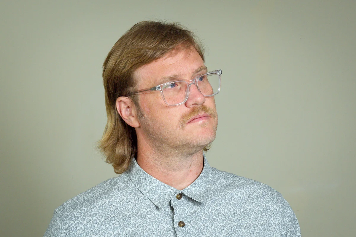 man with an 80s mullet