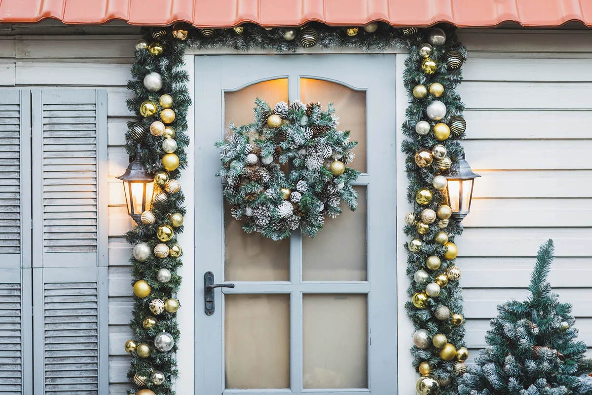 Home decorated for Christmas holidays with wreath trees, ornaments and garlands