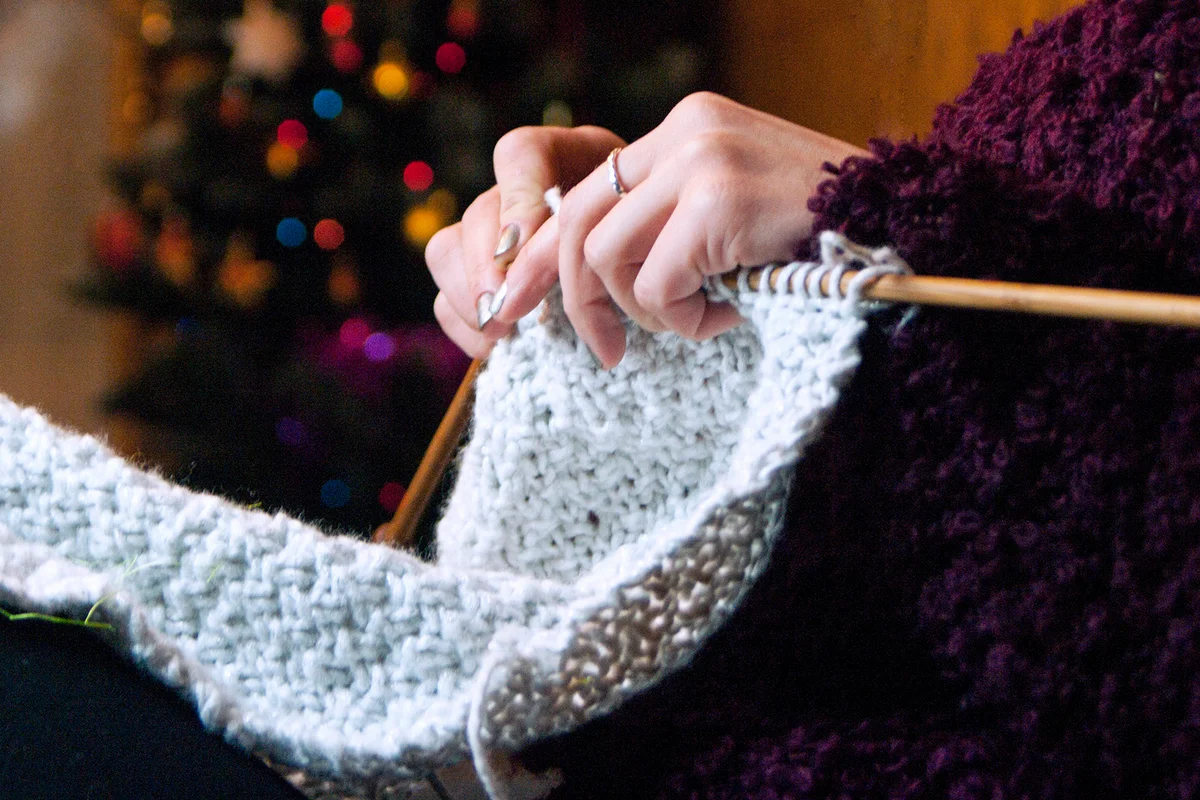 woman crocheting