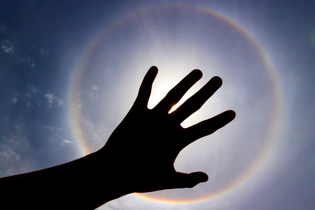 Halo phenomenon or sun with circular rainbow