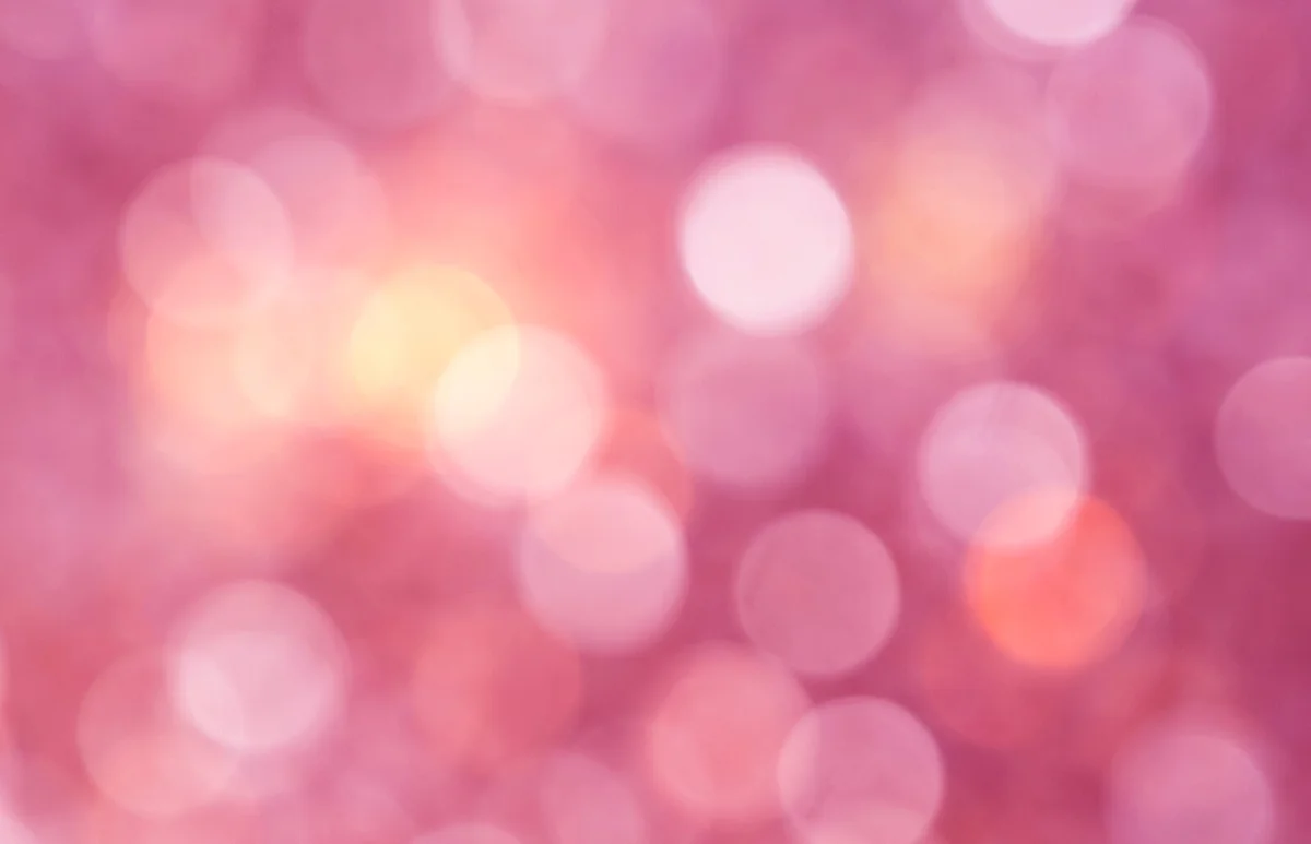 unfocused lights in the shape of circles of pink background