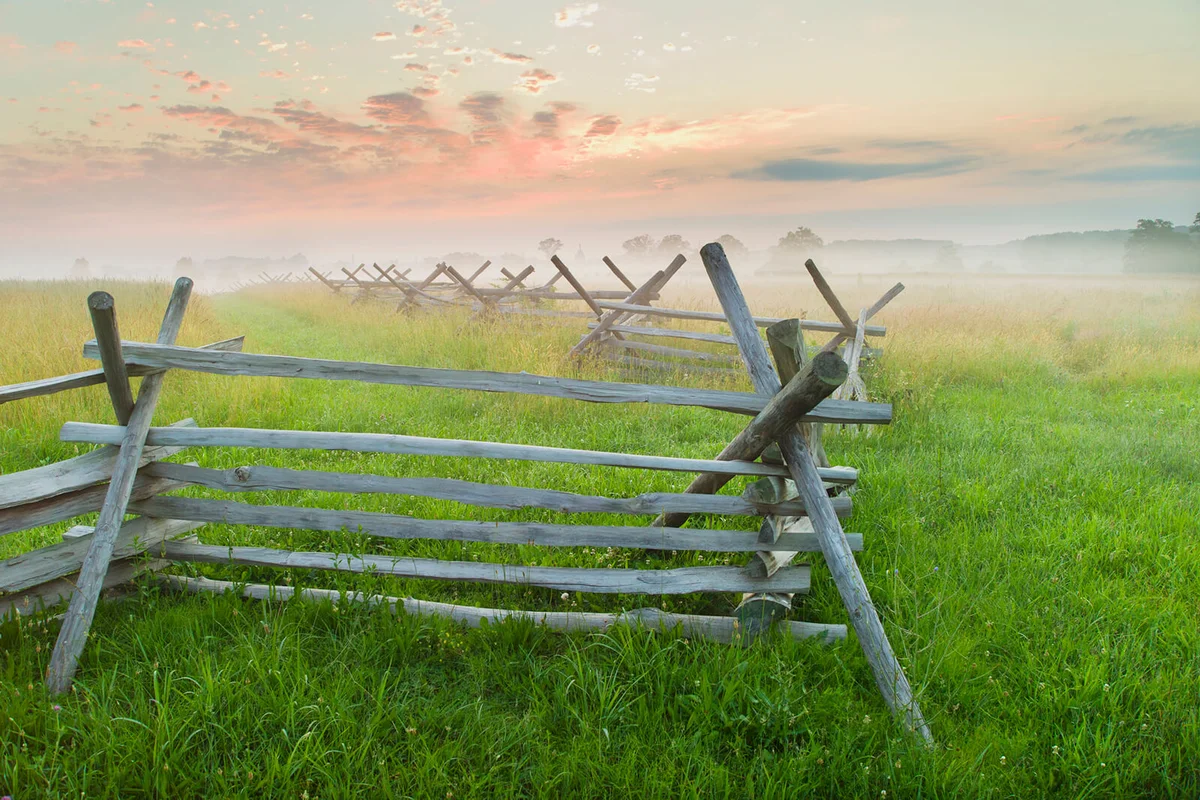 Rustic fence in field