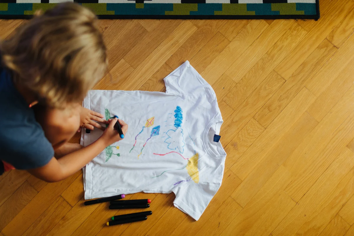 Little Girl Decorating T-Shirt