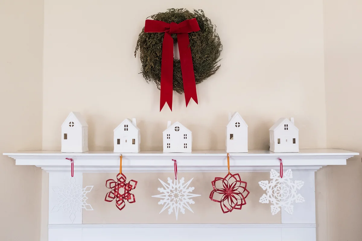 Christmas mantel with white snowflakes