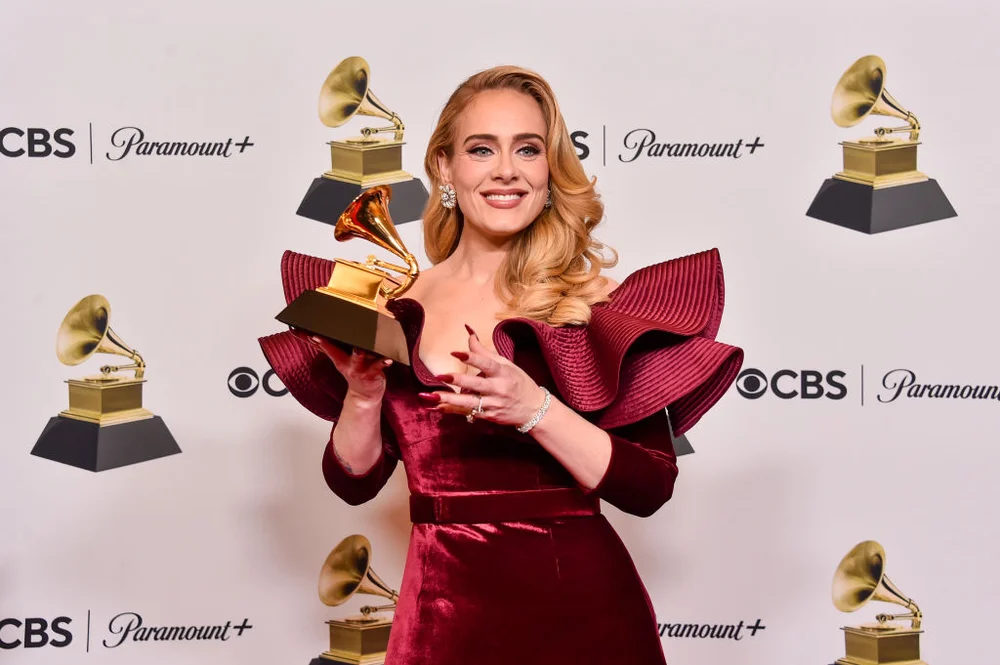 LOS ANGELES, CALIFORNIA - FEBRUARY 05: Adele poses with the Best Pop Solo Performance Award for "Easy on Me" in the press room during the 65th GRAMMY Awards at Crypto.com Arena on February 05, 2023 in Los Angeles, California.