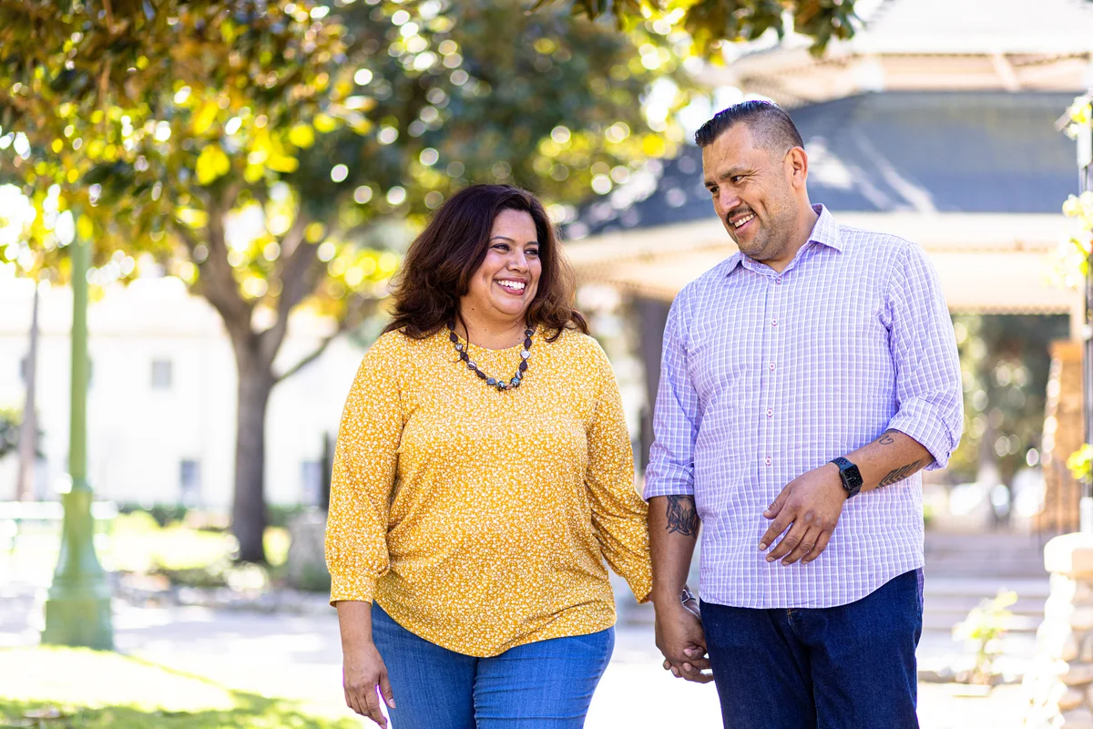 smiling couple holding hands