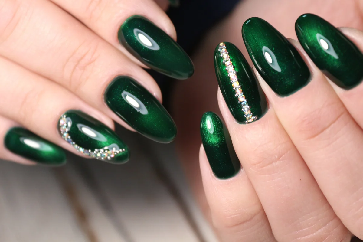 Closeup photo of a beautiful female hands with elegant manicure and diamond rings.