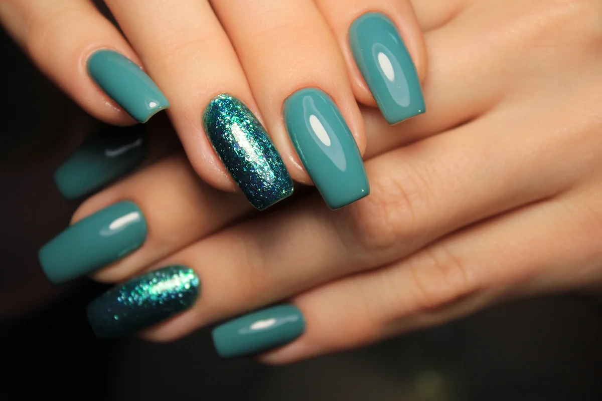 Beautiful woman's nails with beautiful christmas manicure
