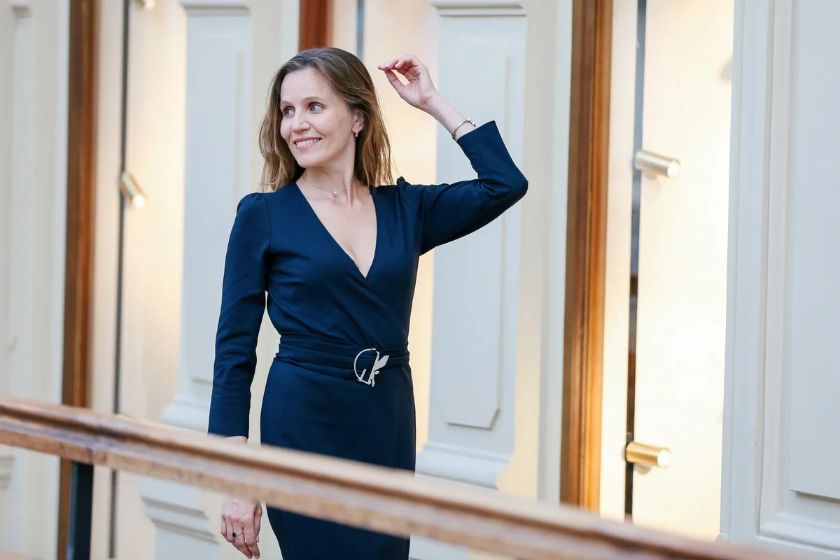 Woman wearing a long sleeve black dress