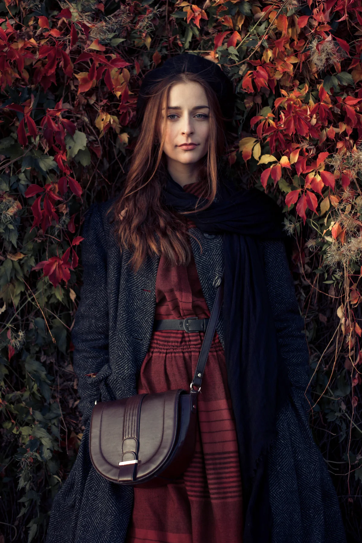Woman with medium-long brown hair resting in the park
