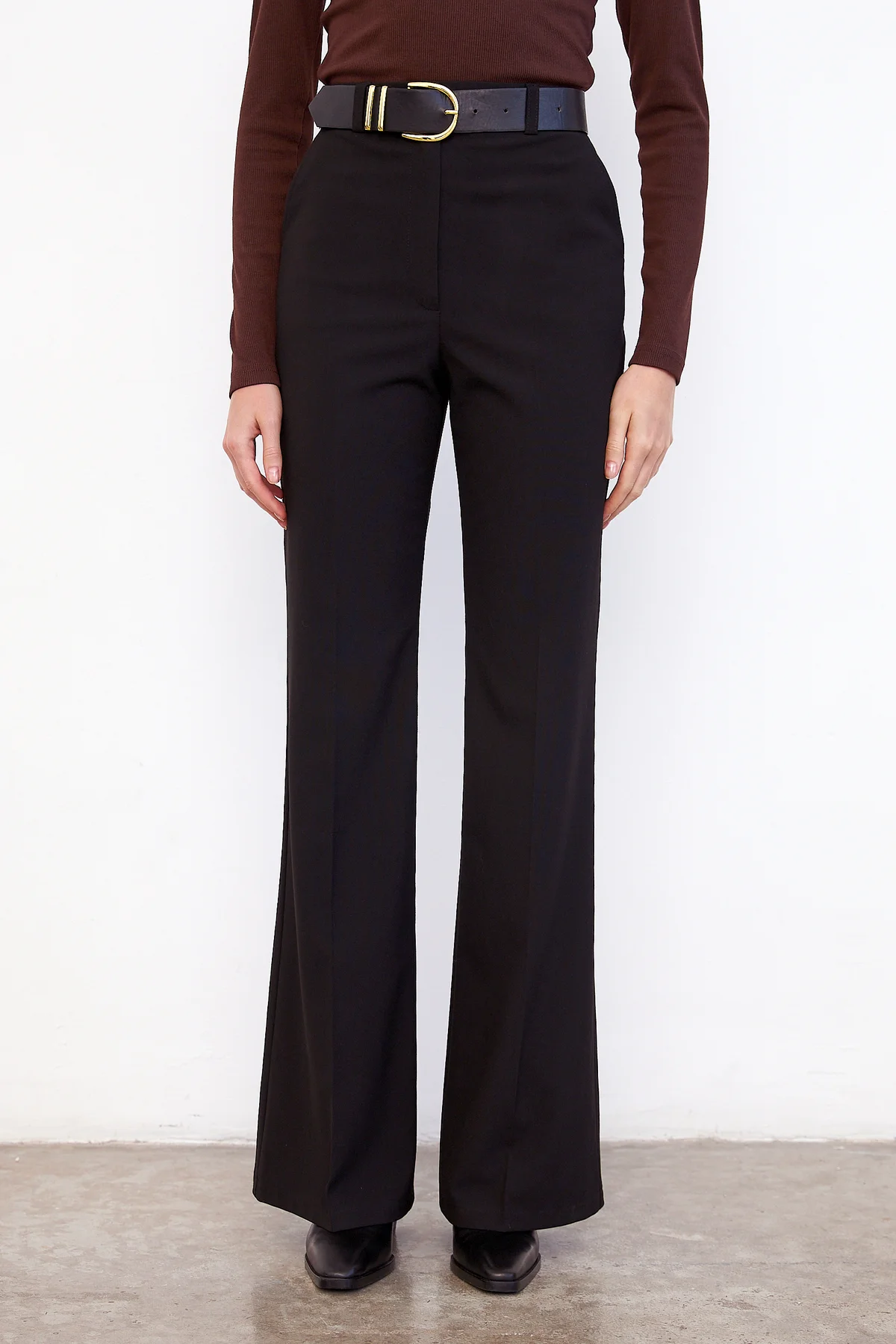 Stylish look with classic sweater and dark pants