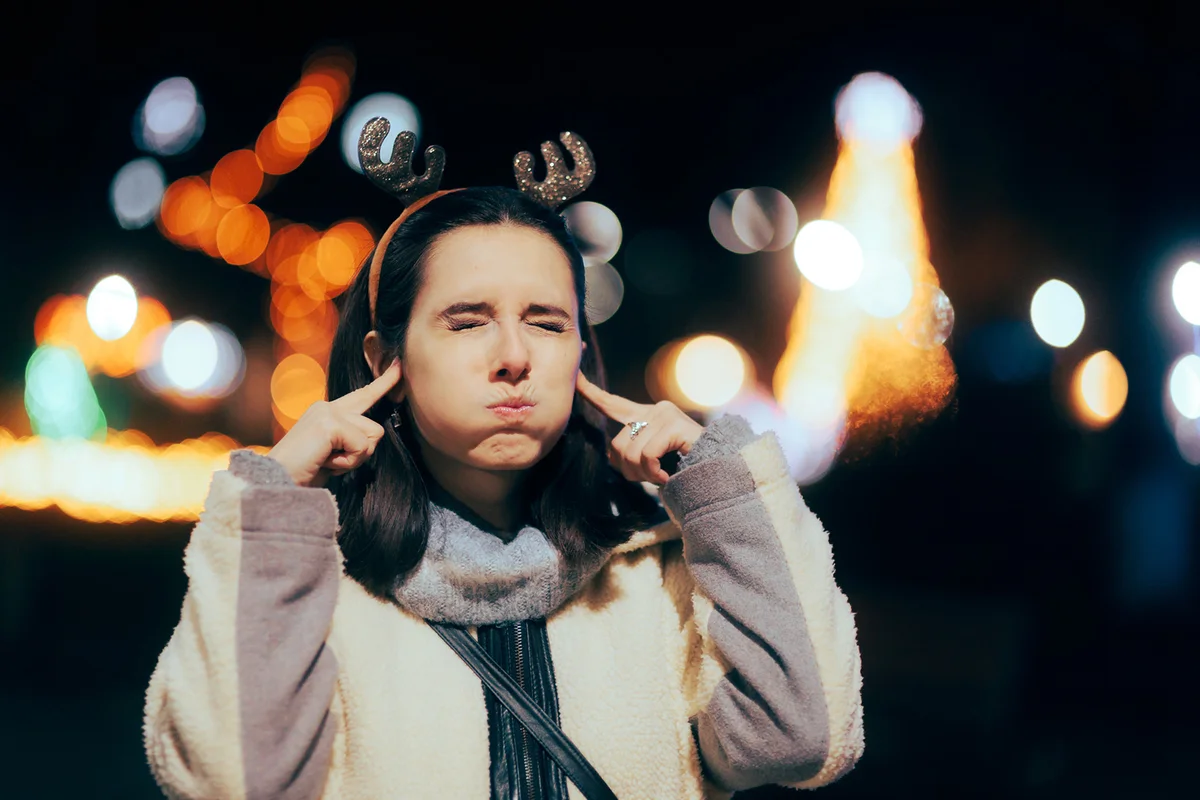 Stressed Woman Annoyed by Christmas Music
