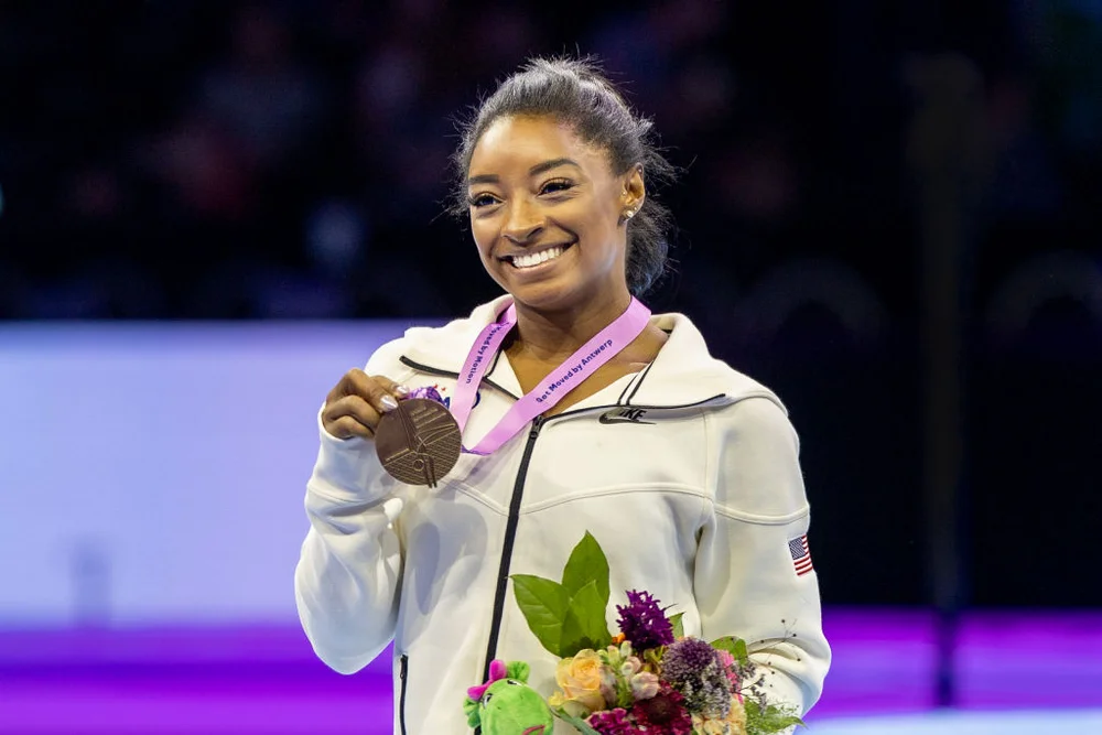 ANTWERP, BELGIUM - October 08: Simone Biles of the United States on the podium with her gold medal after her victory in the Women's Balance Beam Final at the Artistic Gymnastics World Championships-Antwerp 2023 at the Antwerp Sportpaleis on October 8th, 2023 in Antwerp, Belgium.