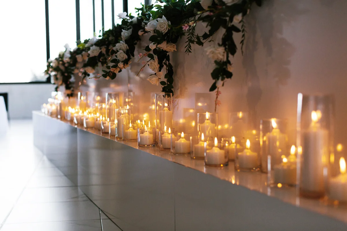 Row of burning candles at a wedding reception