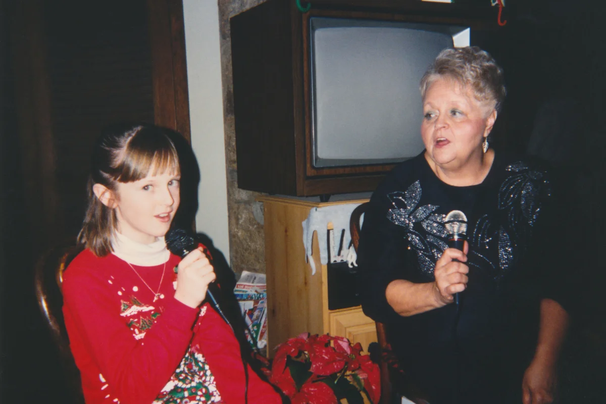 Grandmother and Granddaughter Singing Karaoke