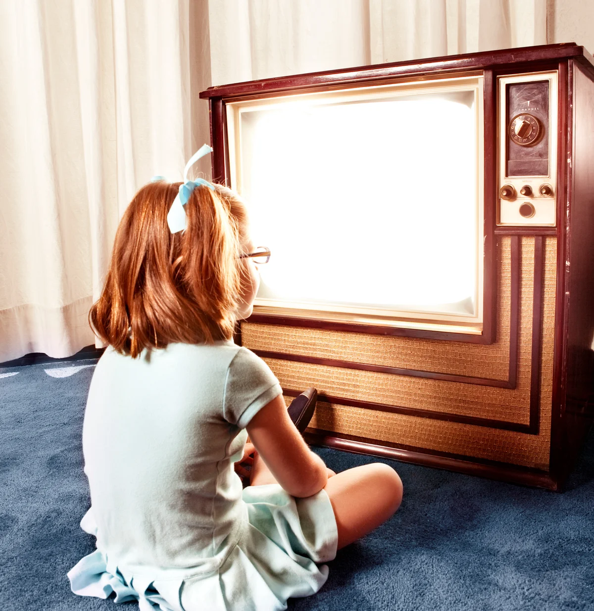 Girl in front on TV waiting